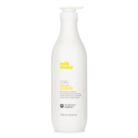 A 1000ml bottle of milk_shake Daily Frequent Conditioner, enriched with milk proteins for soft, shiny, and hydrated hair.