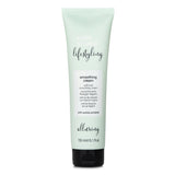 Milk_shake Lifestyling Smoothing Cream in a 150ml tube, designed for smooth, shiny hair with heat and UV protection.