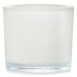 Scented candle featuring white fig and cedarwood fragrance, ideal for creating a calming ambiance in any space.