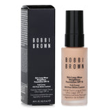 Miniature Bobbi Brown foundation in C-024 Ivory, offering full coverage, SPF 15, and a natural matte finish for all-day wear.