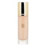 Luxurious foundation with 24-karat gold, offers radiant finish, skincare benefits, housed in elegant glass bottle.