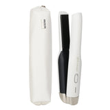 GHD Unplugged cordless styler in white, featuring dual-zone tech for 365°F styling, with chic case for travel-friendly use.