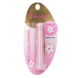 Moisturizing cherry blossom pink lip balm with hyaluronic acid, perfect as a lipstick base for hydration and smooth lips.