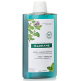 Klorane shampoo with organic mint for detoxifying normal hair, featuring 77% natural ingredients for a refreshing cleanse.