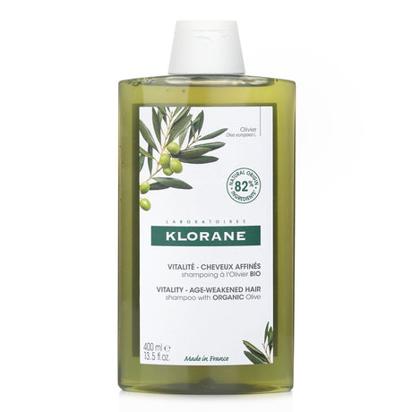 Revitalizing Klorane shampoo with organic olive for age-weakened hair, enhancing thickness and restoring texture.