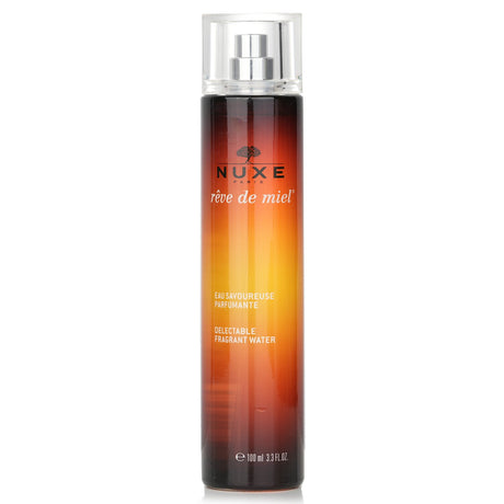 Nuxe Reve De Miel Fragrant Water Spray, 100ml, features honey and floral notes for a refreshing, uplifting scent.