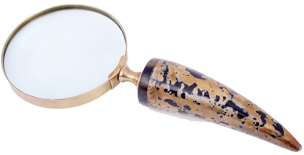 Elegant magnifier glass made of metal and horn, perfect for reading fine print and enhancing home decor.