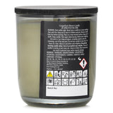 Natural wax candle with grapefruit and citrus scents; hand-poured, 210g, 50-hour burn time, evokes sunlit beach relaxation.