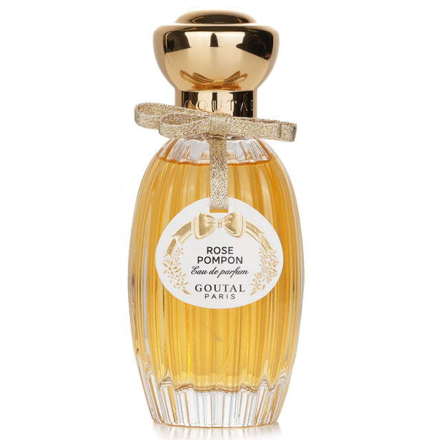 Goutal Rose Pompon Eau De Parfum Spray in a 100ml bottle offers a floral scent of roses, raspberry, and peony for a romantic experience.