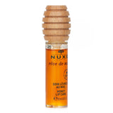 Nuxe Reve De Miel Honey Lip Care, a nourishing balm for dry lips, enriched with honey and natural oils for hydration.