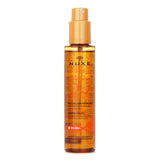 Nuxe Sun Tanning Oil SPF50 in a 150ml bottle, offering high protection and nourishing hydration for face and body under the sun.