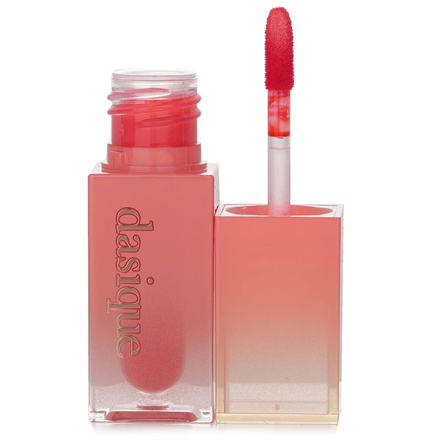 Hydrating oil-infused lip tint in #02 Melon Sherbet, delivering vibrant color and a lustrous shine for soft, plump lips.