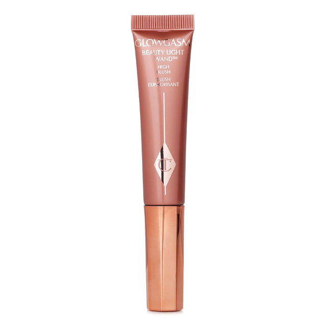 Charlotte Tilbury's Beauty Light Wand in #Pinkgasm, a 12ml liquid blush for a dewy, rosy glow with easy applicator.