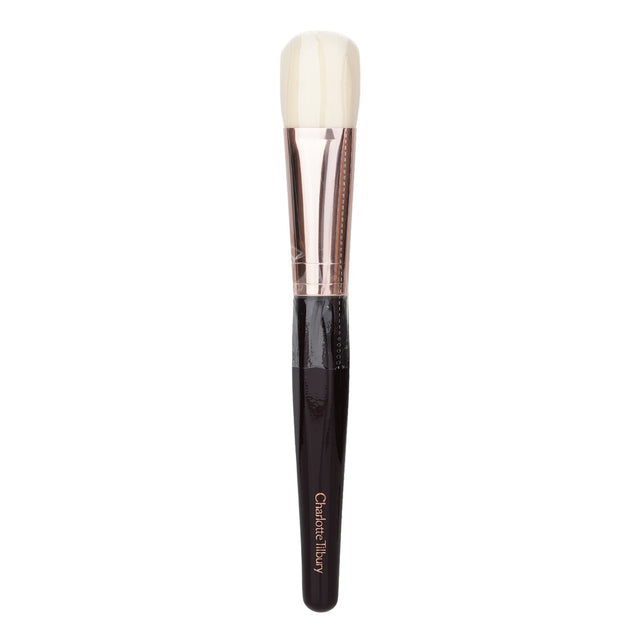 Charlotte Tilbury Magic Complexion Brush featuring a flat head and synthetic bristles for flawless foundation application.