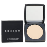 Bobbi Brown Sheer Finish Pressed Powder in Soft Sand, a lightweight powder for a natural, flawless complexion in a sleek compact.