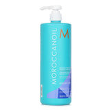 Moroccanoil Blonde Perfecting Purple Shampoo in a 1000ml bottle, neutralizes brassiness for vibrant blonde, lightened, or grey hair.