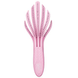 Eco-friendly pink detangling hair brush designed for curly hair, featuring IntelliFlex bristles to minimize breakage and pain.