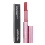 Vivid #140 Buzz lip color by Laura Mercier, glides on smoothly with rich pigments for bold, long-lasting wear.