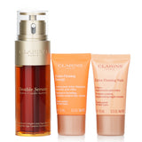 Clarins Rituale Double Serum & Extra Firming Set featuring age-control serum, day cream, night cream, and stylish pouch.