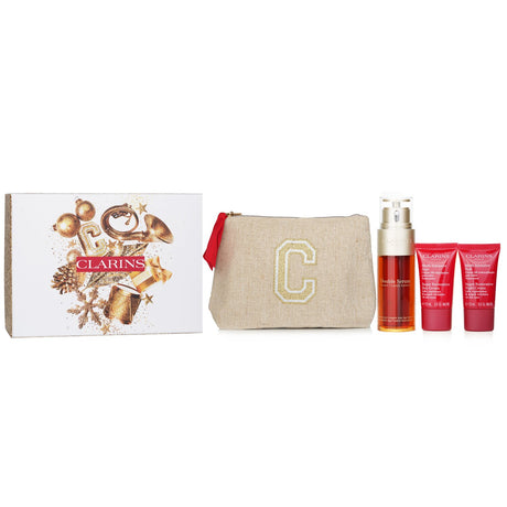 Clarins Rituale Double Serum & Multi Intensive Set with serum, day and night creams, plus a stylish travel pouch.