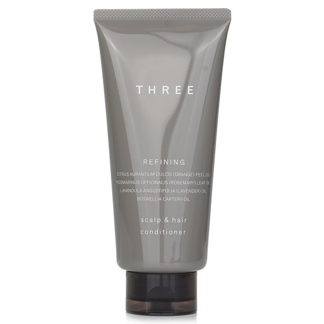 THREE Scalp & Hair Refining Conditioner in a 165g tube, designed to hydrate, repair, and revitalize damaged hair.