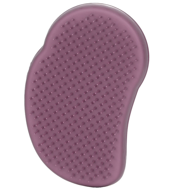 Earth Purple Tangle Teezer hairbrush made from 85% castor beans, featuring two-tiered teeth for effortless detangling.