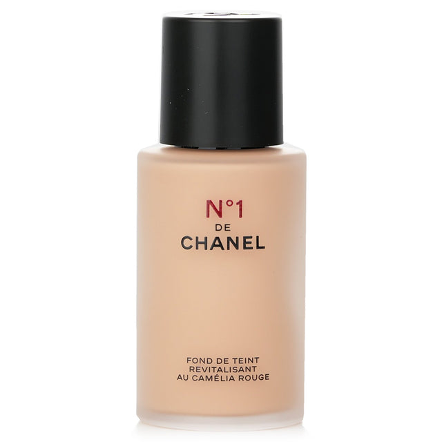 Chanel N°1 Red Camellia Revitalizing Foundation in B30 enhances skin's radiance with nourishing, naturally derived ingredients.