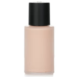 Chanel N°1 Revitalizing Foundation #BR12, 30ml, offers a luminous finish with Red Camellia Oil for radiant, youthful skin.