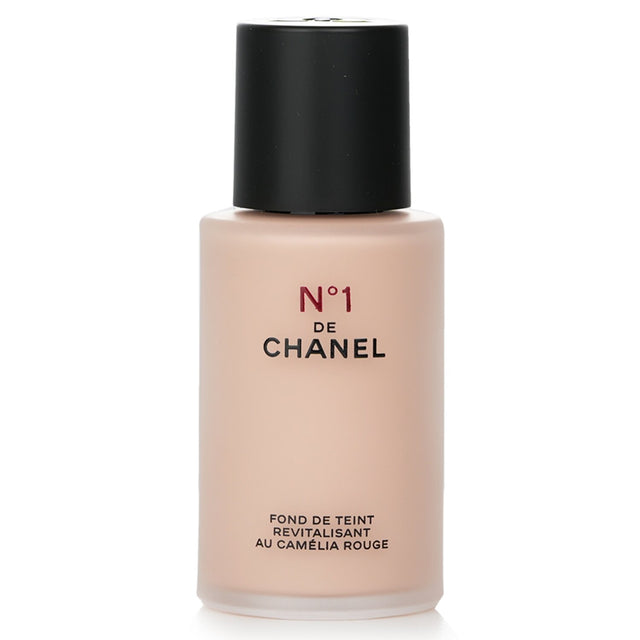 Chanel N�1 De Chanel Red Camellia Revitalizing Foundation in #BR12, offering buildable coverage and a luminous, youthful glow.