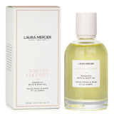 Luxurious Laura Mercier Almond Coconut Body Oil in a 100ml bottle, deeply hydrates skin with a delightful coconut-almond scent.