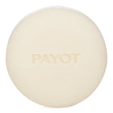 Solid shampoo bar by Payot, 80g, with 86% natural ingredients, revitalizes hair, and features bergamot and cedar scents.