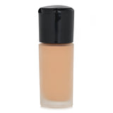 Hydrating MAC Studio Radiance Foundation #NW13, enriched with 10% hyaluronic acid for a luminous, smooth complexion.