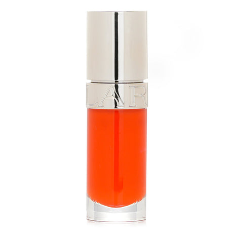 Clarins Lip Comfort Oil in Daring Orange, a hydrating blend with Sweetbriar Rose Oil for nourished, vibrant lips.