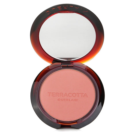 Guerlain Terracotta Blush in #02 Corail, a lightweight coral powder blush for a natural, radiant glow.