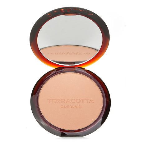 Guerlain Terracotta Bronzing Powder #00 Light Cool, a lightweight bronzer with 96% natural ingredients for a radiant glow.