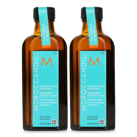 Moroccanoil Treatment Duo Set for all hair types, featuring two 100ml bottles of frizz-reducing, nourishing oil.