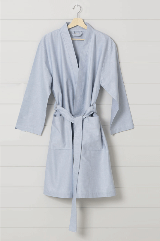 Light blue cotton kimono-style robe with pockets, waist tie, and OEKO-TEX® certification, designed for comfort.