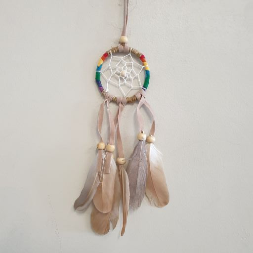 Handcrafted 6 cm brown crochet dream catcher with intricate design, ideal for home decor and positive energy.