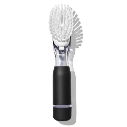 Ergonomic soap dispensing dish brush with durable bristles, drip-free valve, and built-in scraper for easy dish cleaning.