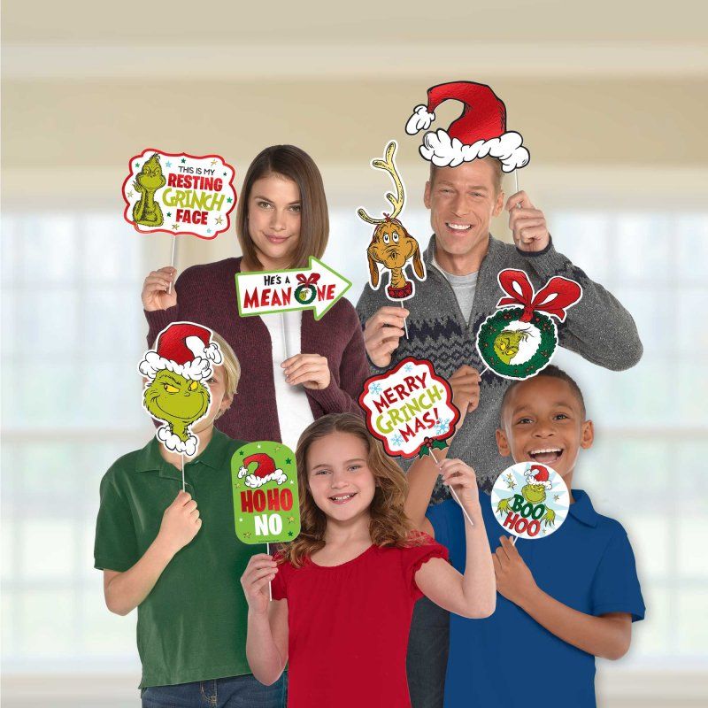 Dr. Seuss The Grinch Photo Prop Kit featuring 13 assorted designs for festive photo fun.