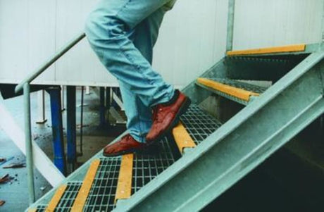 Yellow composite stair nosing, 450mm, slip-resistant, rust-proof, flame retardant, enhances safety for indoor and outdoor steps.