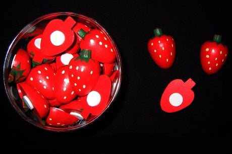 Colorful mini wooden strawberries with adhesive backs, perfect for various crafts and decorations. Box of 24 units.