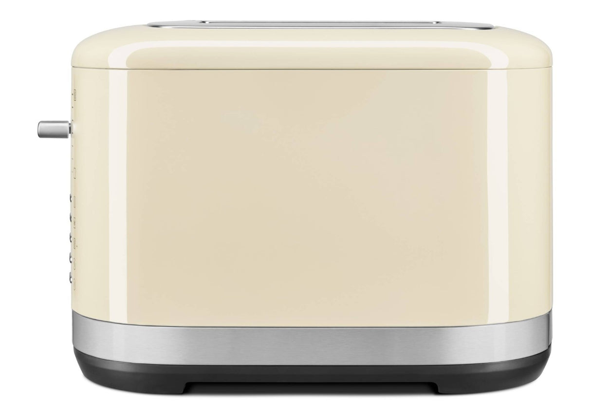 KitchenAid 2 Slice Toaster in Almond Cream with extra wide slots, 7 shade settings, and versatile functions for perfect toast.