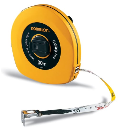 Durable Komelon Fibreglass Tape 30m with comfortable grip, Class II accuracy, and sturdy closed yellow ABS case.