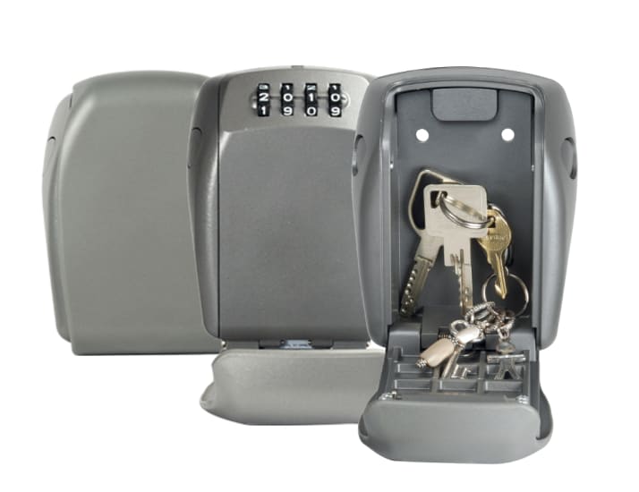 Robust Master Lock 5415 wall mount lock box, 105 x 135mm, weather-resistant, holds keys/cards, 4-digit combination for security.