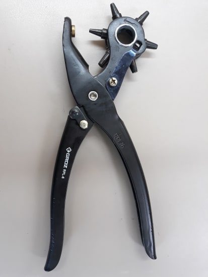 Groz Revolving Punch Plier 316100 with rotating head and six punch sizes for precise holes in leather, rubber, plastic, and cardboard.