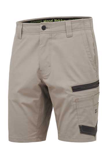 Hard Yakka Raptor Active Shorts in Desert color, featuring durable ripstop fabric, expandable waistband, and functional tool pockets.