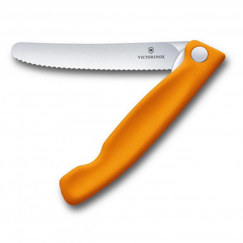 Vibrant orange Victorinox foldable paring knife with a wavy stainless steel blade, perfect for versatile kitchen tasks.