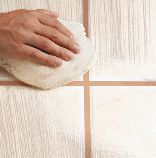 Highly absorbent white cotton stockinette cleaning cloth roll, ideal for spills, stains, painting, and polishing tasks.