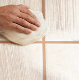 Highly absorbent white cotton stockinette cleaning cloth roll, ideal for spills, stains, painting, and polishing tasks.